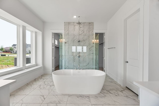 1758 Cousins Trl, Frisco, TX 75034 - full bathroom with marble look tiles, a marble finish shower, a freestanding tub, baseboards, and recessed lighting
