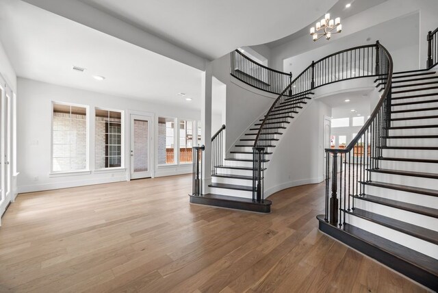 1758 Cousins Trl, Frisco, TX 75034 - foyer entrance featuring stairway, a chandelier, wood finished floors, baseboards, and recessed lighting