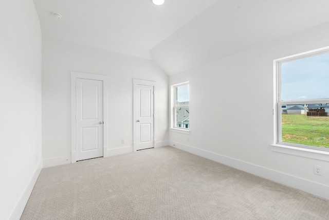 1758 Cousins Trl, Frisco, TX 75034 - unfurnished bedroom featuring carpet floors, multiple windows, baseboards, and lofted ceiling