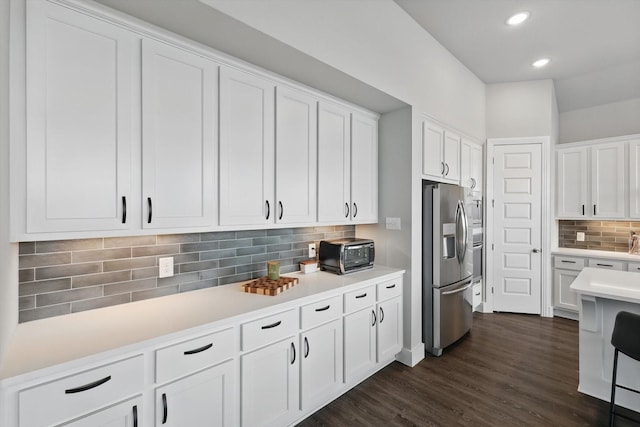 4121 Crossroads Ct, Oak Point, TX 75068 - kitchen with stainless steel fridge with ice dispenser, tasteful backsplash, white cabinets, light countertops, and recessed lighting