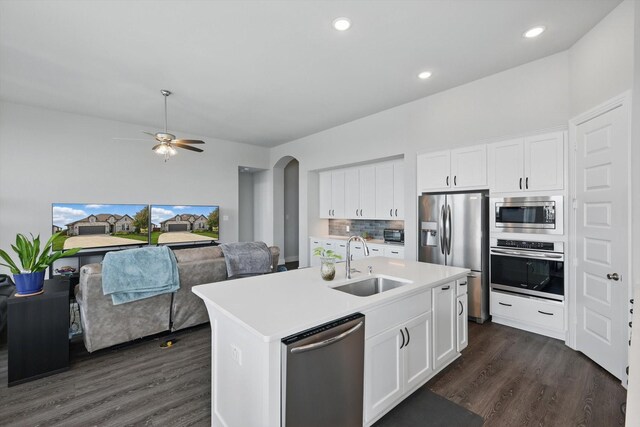 4121 Crossroads Ct, Oak Point, TX 75068 - kitchen with appliances with stainless steel finishes, dark wood-style flooring, backsplash, light countertops, and open floor plan