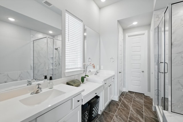 4121 Crossroads Ct, Oak Point, TX 75068 - bathroom with double vanity, a stall shower, marble look tile flooring, and recessed lighting