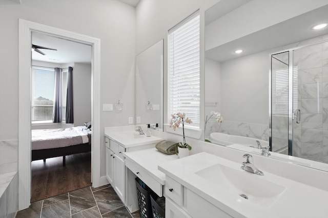 4121 Crossroads Ct, Oak Point, TX 75068 - ensuite bathroom with double vanity, a garden tub, marble finish flooring, a shower stall, and recessed lighting
