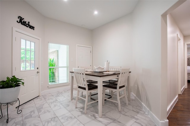 509 Farine Dr, Irving, TX 75062 - dining space with baseboards, light marble finish flooring, plenty of natural light, and recessed lighting