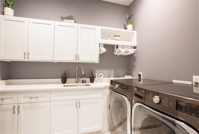 509 Farine Dr, Irving, TX 75062 - clothes washing area with cabinet space and washer and dryer