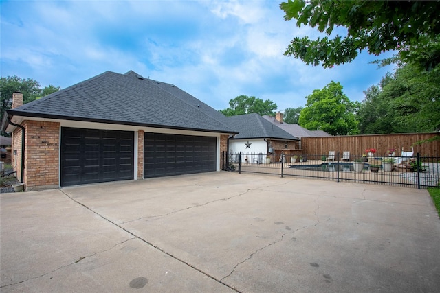 509 Farine Dr, Irving, TX 75062 - view of property exterior with fence, a shingled roof, a chimney, and brick siding