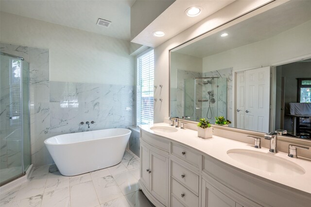 1433 Rogers Ct, Allen, TX 75013 - bathroom with a marble finish shower, marble finish floors, double vanity, recessed lighting, and a freestanding tub