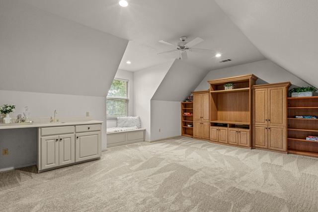 additional living space featuring vaulted ceiling, light colored carpet, a sink, ceiling fan, and recessed lighting
