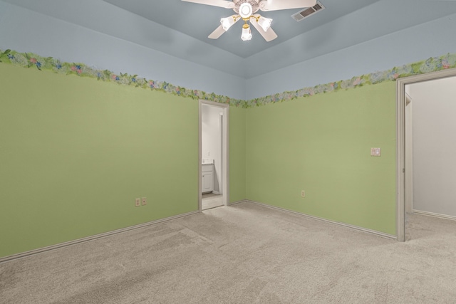 empty room with light carpet, ceiling fan, and baseboards