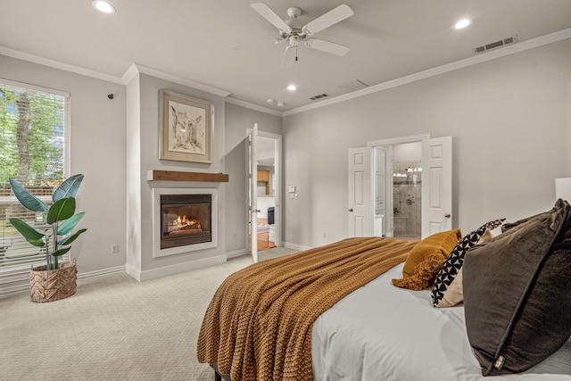 bedroom with baseboards, recessed lighting, light colored carpet, a glass covered fireplace, and crown molding