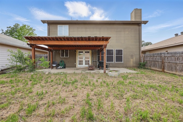 2324 Southway, Denton, TX 76207 - back of house with a patio area, a fenced backyard, french doors, and a chimney