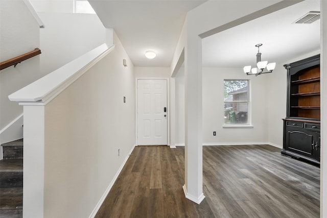 2324 Southway, Denton, TX 76207 - hallway featuring a chandelier, dark wood-style floors, stairway, and baseboards