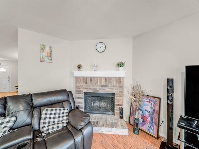 9228 Cheswick Dr, Fort Worth, TX 76123 - living area with wood finished floors and a brick fireplace