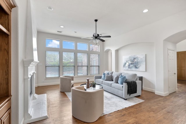 11393 Classic Ln, Frisco, TX 75033 - living room with arched walkways, ceiling fan, wood finished floors, baseboards, and recessed lighting