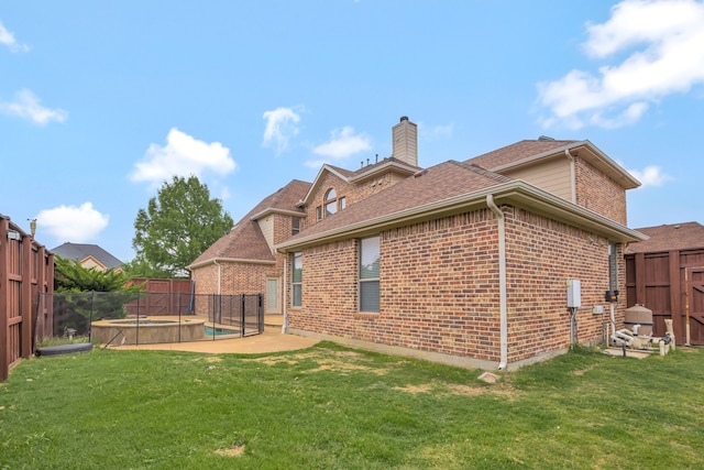 11393 Classic Ln, Frisco, TX 75033 - back of property featuring a chimney, brick siding, a swimming pool, a patio area, and roof with shingles