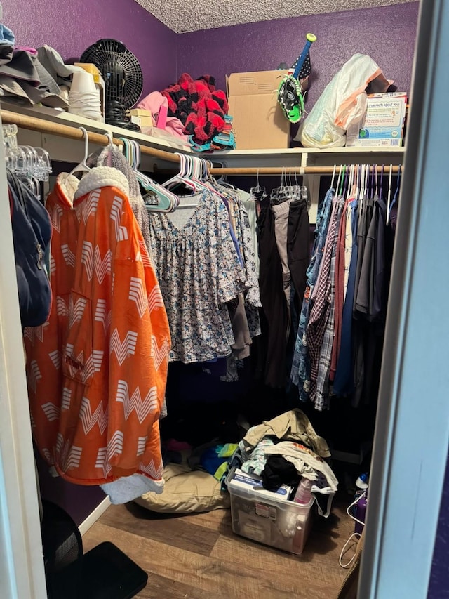 419 Travis St, Ranger, TX 76470 - walk in closet featuring wood finished floors