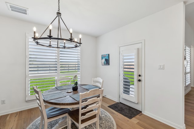 2171 Cloverfern Way, Haslet, TX 76052 - dining room featuring a chandelier, light wood finished floors, and baseboards