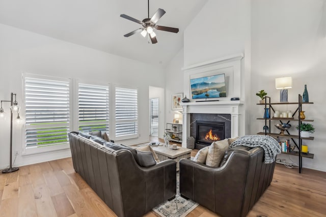 2171 Cloverfern Way, Haslet, TX 76052 - living area featuring high vaulted ceiling, ceiling fan, a fireplace, light wood-style floors, and baseboards