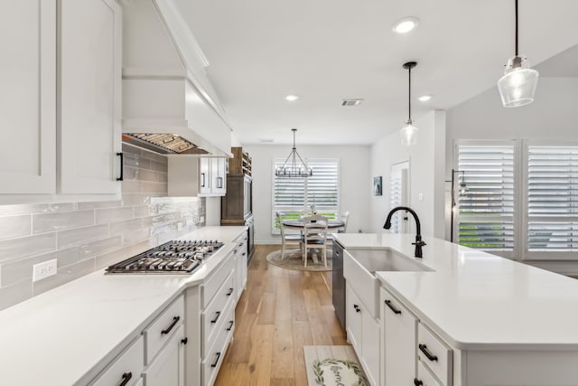 2171 Cloverfern Way, Haslet, TX 76052 - kitchen with stainless steel appliances, a sink, custom exhaust hood, recessed lighting, and backsplash