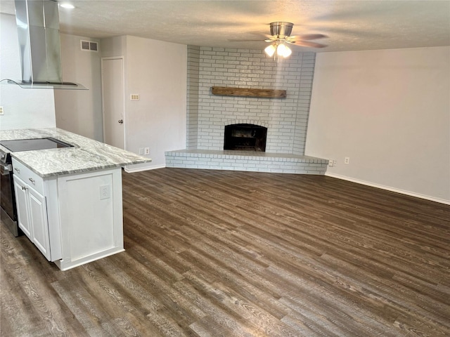 553 Oldbridge Dr, Allen, TX 75002 - kitchen featuring wall chimney range hood, electric stove, ceiling fan, dark wood-style floors, and baseboards