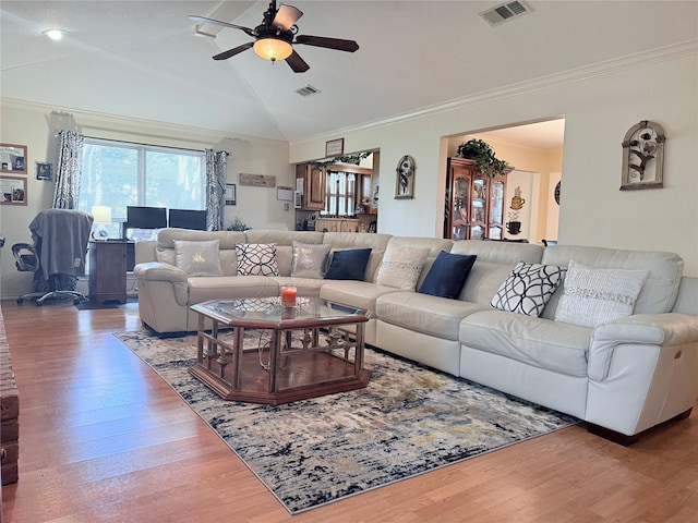 850 Oakbluff Dr, Lancaster, TX 75146 - living room featuring wood finished floors, ceiling fan, vaulted ceiling, and ornamental molding