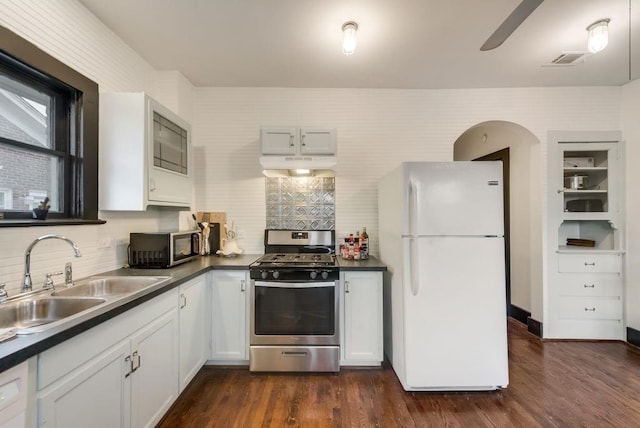 803 Woodlawn Ave Full Bldg, Full Bldg, Dallas, TX 75208 - kitchen featuring appliances with stainless steel finishes, a sink, exhaust hood, and dark countertops