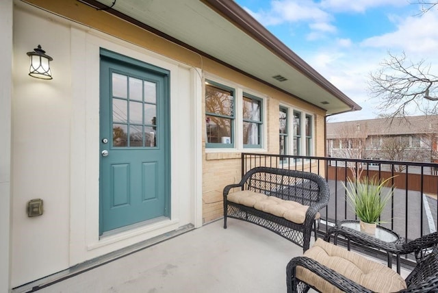 803 Woodlawn Ave Full Bldg, Full Bldg, Dallas, TX 75208 - view of exterior entry with a balcony and brick siding