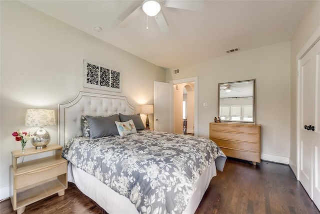 803 Woodlawn Ave Full Bldg, Full Bldg, Dallas, TX 75208 - bedroom with arched walkways, dark wood-style floors, ceiling fan, and baseboards