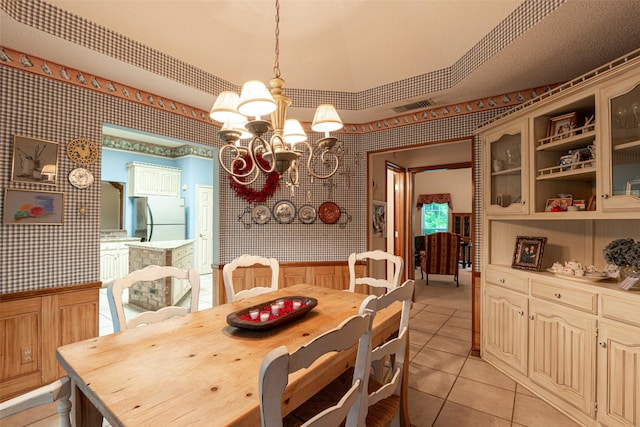 521 Crestridge Rd, Heath, TX 75032 - dining room featuring wallpapered walls, a chandelier, and light tile patterned flooring