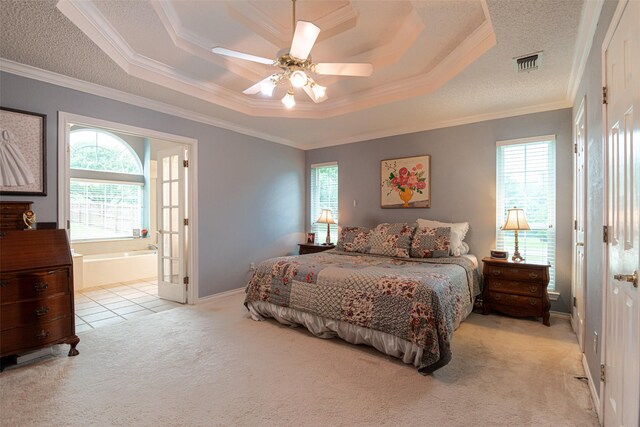 521 Crestridge Rd, Heath, TX 75032 - bedroom featuring light carpet, a tray ceiling, crown molding, a textured ceiling, and ensuite bathroom