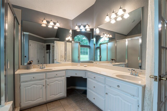 521 Crestridge Rd, Heath, TX 75032 - full bath featuring lofted ceiling, tile patterned flooring, a shower stall, and double vanity