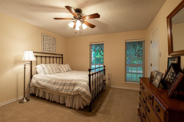 521 Crestridge Rd, Heath, TX 75032 - carpeted bedroom with baseboards, a textured ceiling, and a ceiling fan