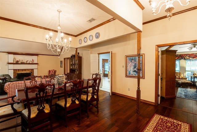 521 Crestridge Rd, Heath, TX 75032 - dining space featuring a chandelier, ornamental molding, wood-type flooring, a brick fireplace, and baseboards