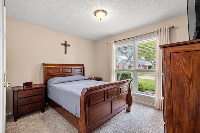 6706 Trumpet Dr, Rowlett, TX 75089 - bedroom with light colored carpet, a textured ceiling, and baseboards