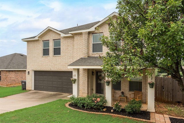 7536 Brentwood Stair Rd, Fort Worth, TX 76112 - view of front of home with a garage, concrete driveway, covered porch, brick siding, and a shingled roof