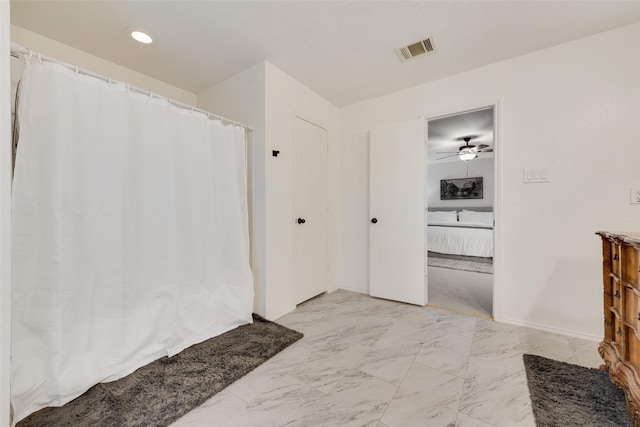 7536 Brentwood Stair Rd, Fort Worth, TX 76112 - ensuite bathroom featuring marble finish flooring, curtained shower, and ceiling fan