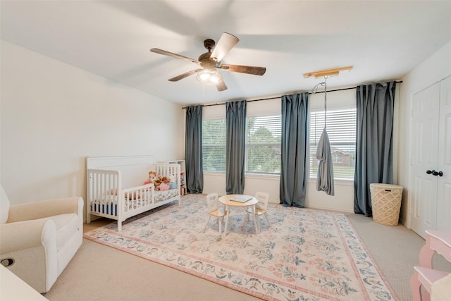 7536 Brentwood Stair Rd, Fort Worth, TX 76112 - carpeted bedroom featuring a closet, ceiling fan, and a nursery area