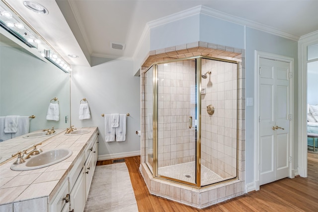 3437 Purdue St, University Park, TX 75225 - bathroom featuring wood finished floors, a stall shower, baseboards, and ornamental molding