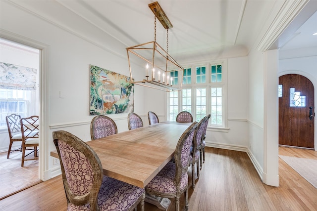 3437 Purdue St, University Park, TX 75225 - dining room with light wood-style floors, a chandelier, and arched walkways