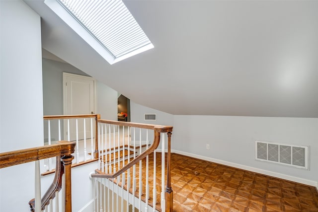 3437 Purdue St, University Park, TX 75225 - hall with an upstairs landing, a skylight, vaulted ceiling, and baseboards