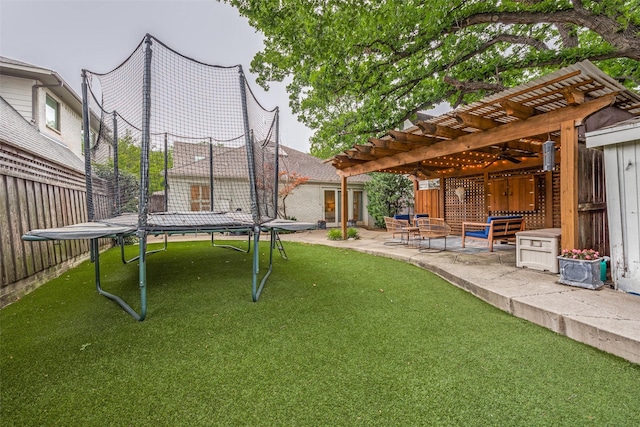 3437 Purdue St, University Park, TX 75225 - view of green lawn with a trampoline, a pergola, ceiling fan, and a patio area