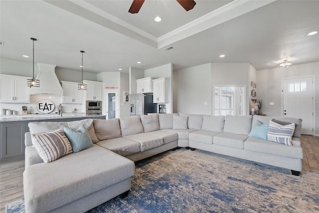 115 Lavender Ln, Springtown, TX 76082 - living room with recessed lighting, light wood-style floors, a ceiling fan, and crown molding