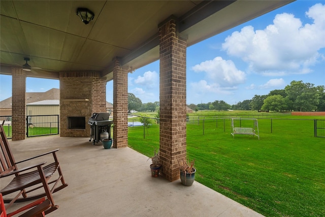 115 Lavender Ln, Springtown, TX 76082 - view of patio with grilling area and a large fireplace