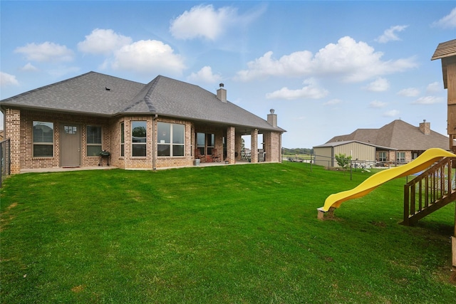 115 Lavender Ln, Springtown, TX 76082 - back of house with a playground, brick siding, a patio area, roof with shingles, and a chimney