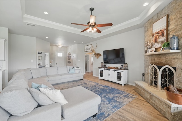 115 Lavender Ln, Springtown, TX 76082 - living area with a raised ceiling, ceiling fan, wood finished floors, recessed lighting, and ornamental molding