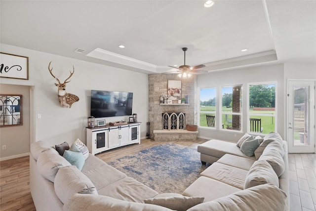 115 Lavender Ln, Springtown, TX 76082 - living room with a tray ceiling, wood finished floors, a ceiling fan, baseboards, and recessed lighting