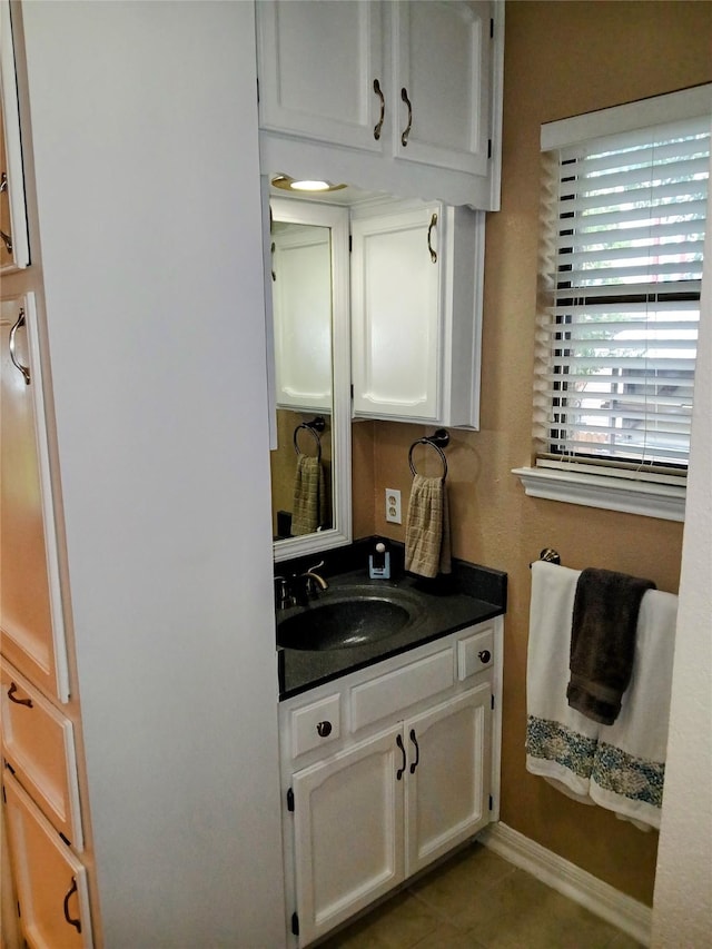 650 Sp Terry Rd, Belton, TX 76513 - bathroom with vanity, baseboards, and tile patterned floors