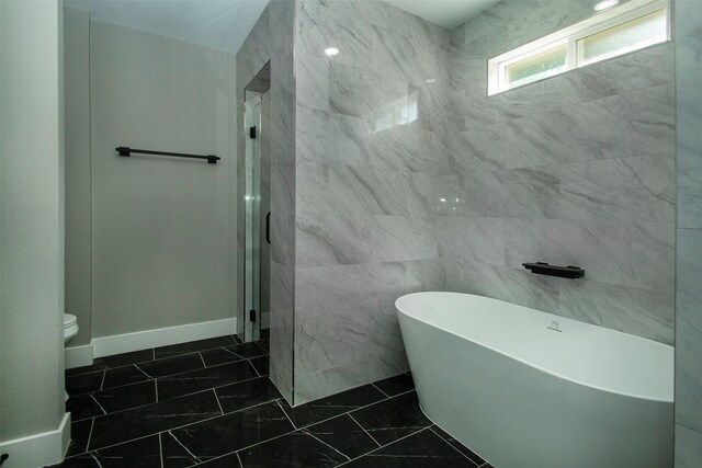 519 W James St, Wills Point, TX 75169 - full bath featuring a freestanding bath, toilet, a walk in shower, and tile walls