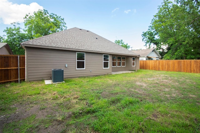 519 W James St, Wills Point, TX 75169 - back of property featuring central air condition unit and roof with shingles