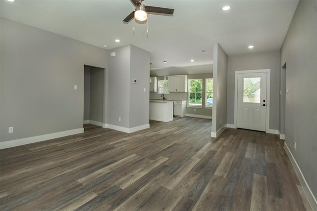 519 W James St, Wills Point, TX 75169 - unfurnished living room with dark wood finished floors, ceiling fan, baseboards, a sink, and recessed lighting